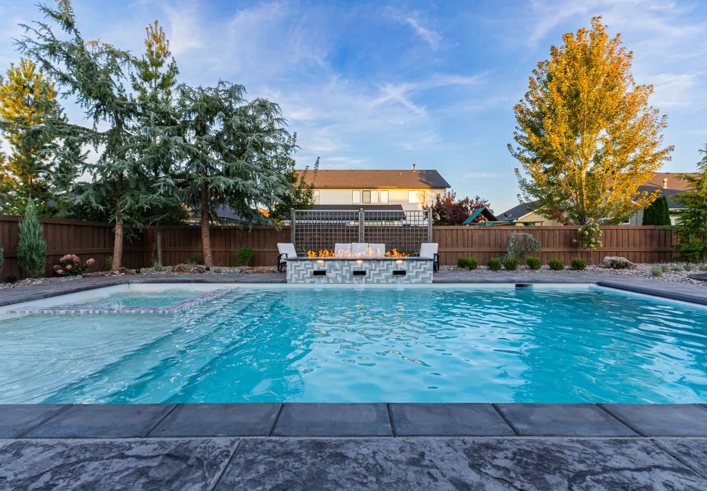 Backyard pool with spa and stamped concrete deck