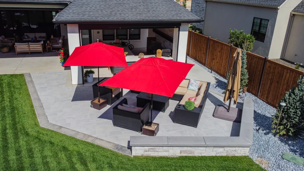 Covered patio with lounge seating next to the pool