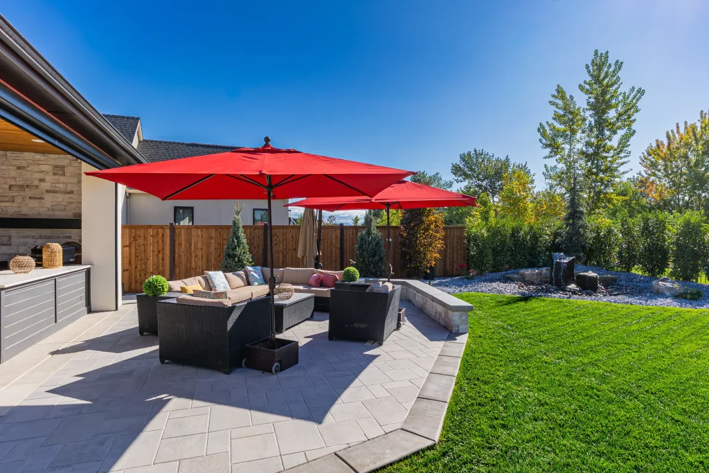 Covered patio with lounge seating next to the pool