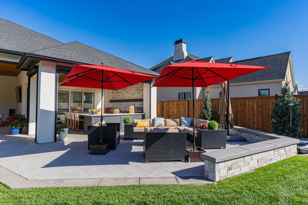 Covered patio with lounge seating next to the pool
