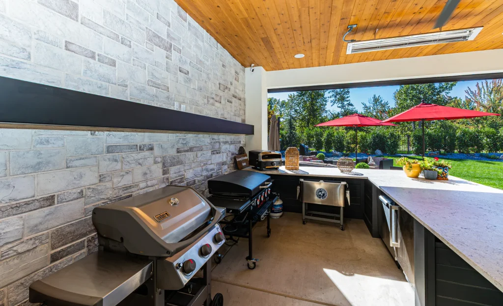 Outdoor kitchen with a stone feature wall